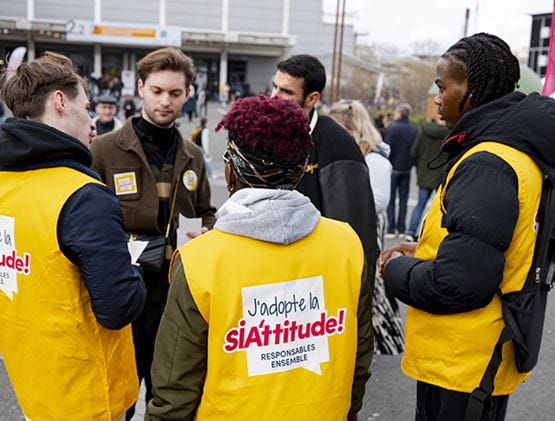 Group of people wearing SIA'TTITUDE waistcoats